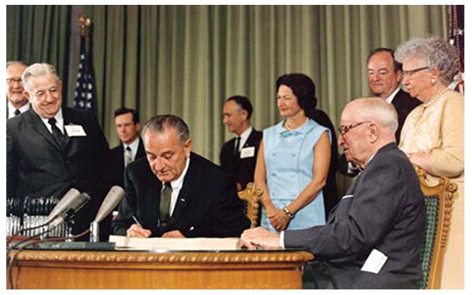 LBJ signing Public Law 89-97